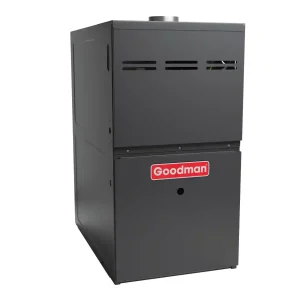 Goodman gas furnace unit isolated on a light gray background.